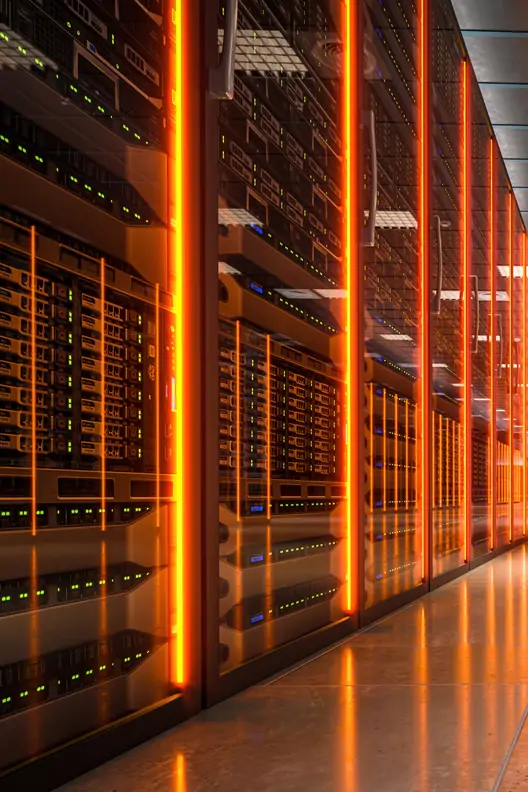 A photograph of an advanced data center with rows of high-tech server cabinets, illuminated by bright orange LED lights, showcasing the precision and complexity behind modern AI & cloud computing operations.
